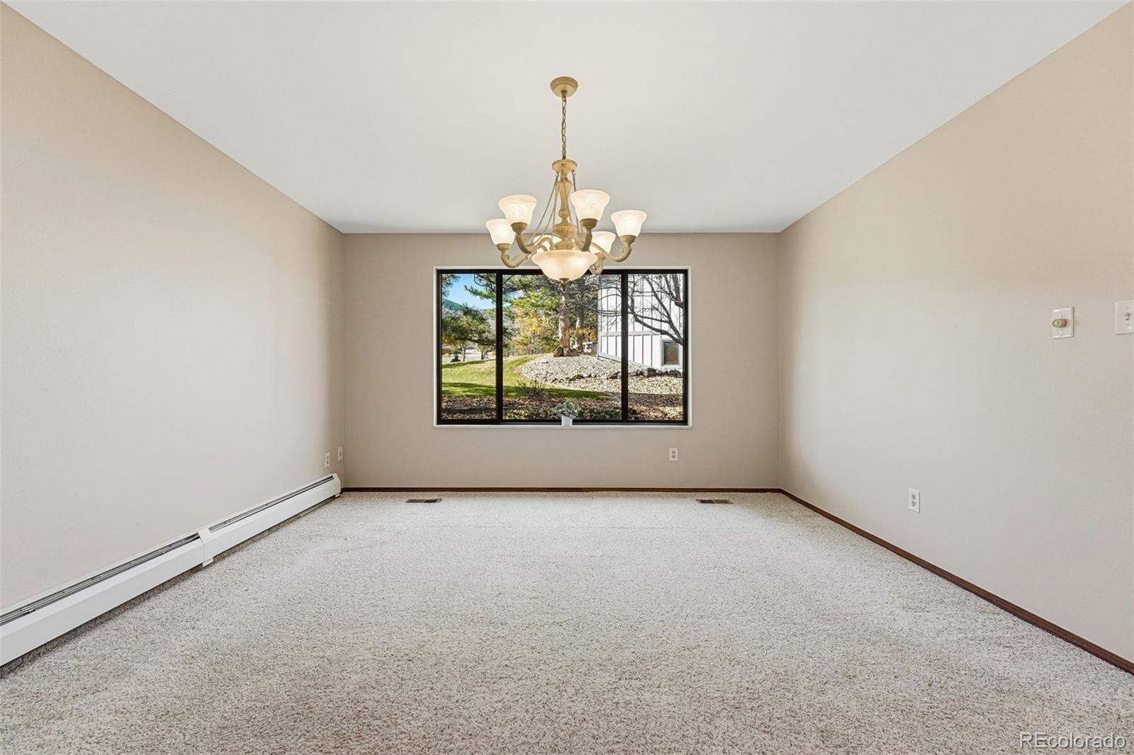 16066 Ridge Tee Drive Morrison, CO 80465 - Photo 19 of 41 a view of an empty room with a window