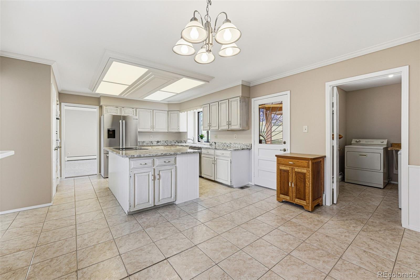 16066 Ridge Tee Drive Morrison, CO 80465 - Photo 21 of 41 a kitchen with a cabinets and counter space