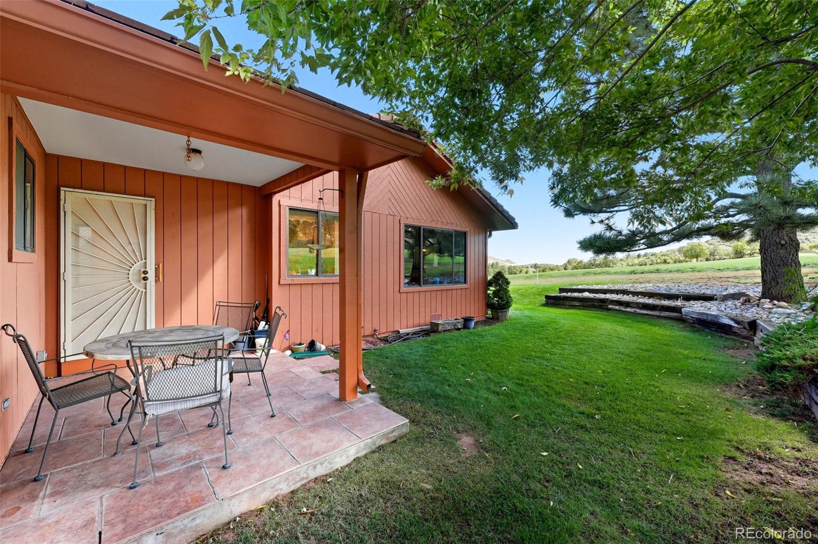 16066 Ridge Tee Drive Morrison, CO 80465 - Photo 25 of 41 a garden view with a seating space