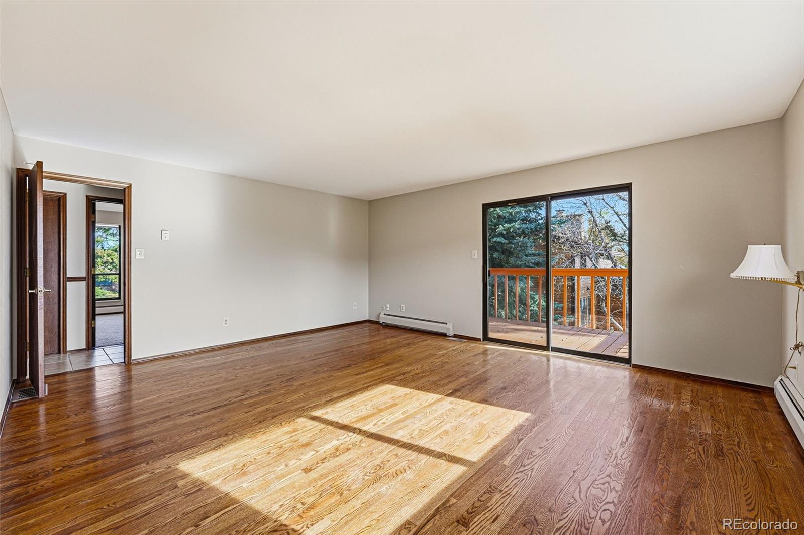 16066 Ridge Tee Drive Morrison, CO 80465 - Photo 28 of 41 wooden floor in an empty room with a window