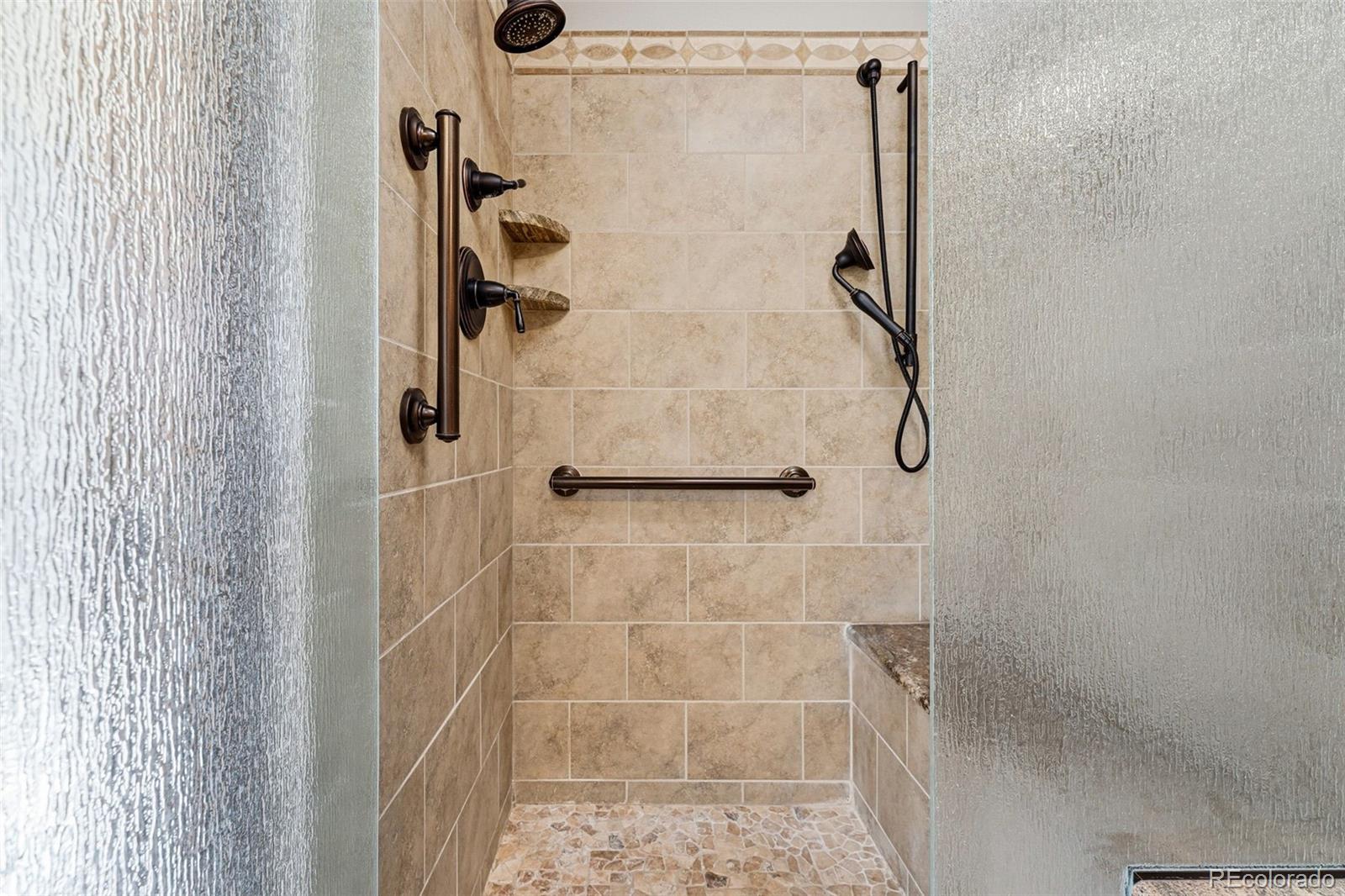 16066 Ridge Tee Drive Morrison, CO 80465 - Photo 30 of 41 a bathroom with a shower