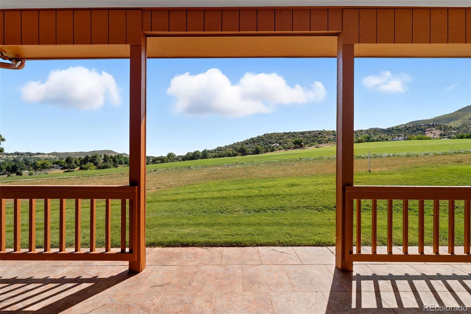 16066 Ridge Tee Drive Morrison, CO 80465 - Photo 3 of 41 a view of ocean from a balcony