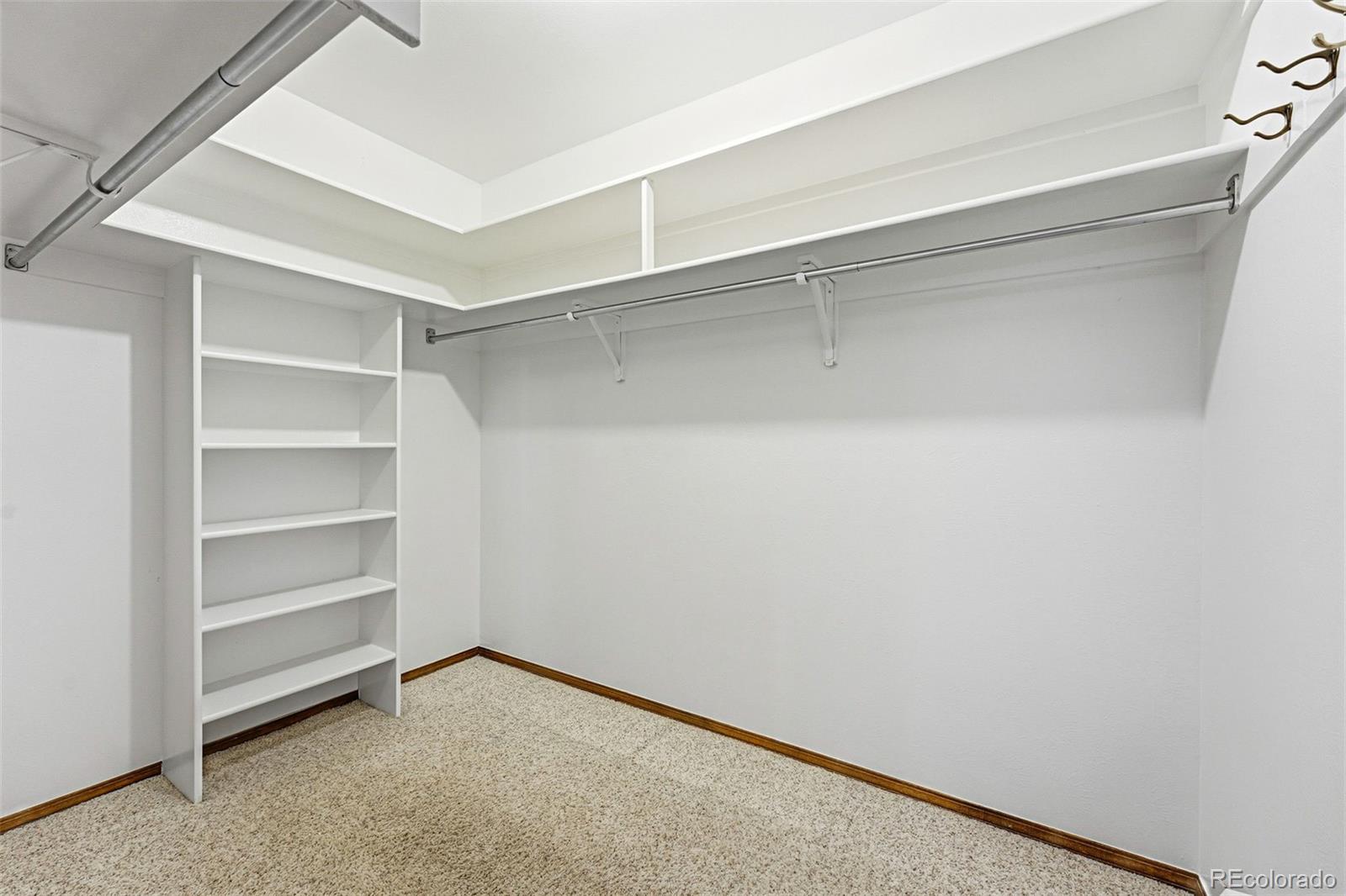 16066 Ridge Tee Drive Morrison, CO 80465 - Photo 31 of 41 a view of an empty walk in closet