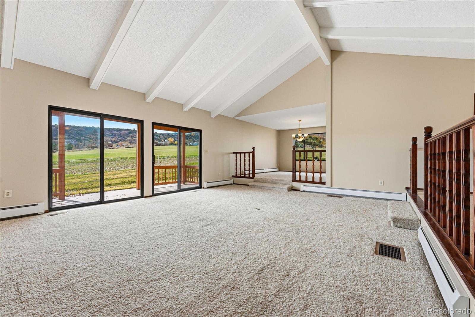 16066 Ridge Tee Drive Morrison, CO 80465 - Photo 6 of 41 a view of an empty room with a balcony