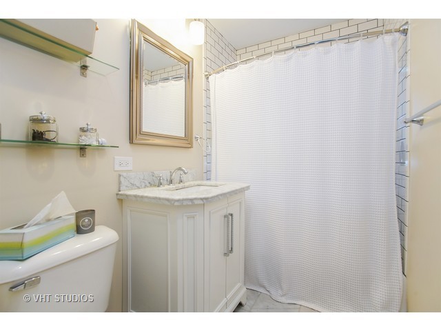 1813 Marguerite Street Park Ridge, IL 60068 - Photo 12 of 15 a bathroom with a sink and mirror
