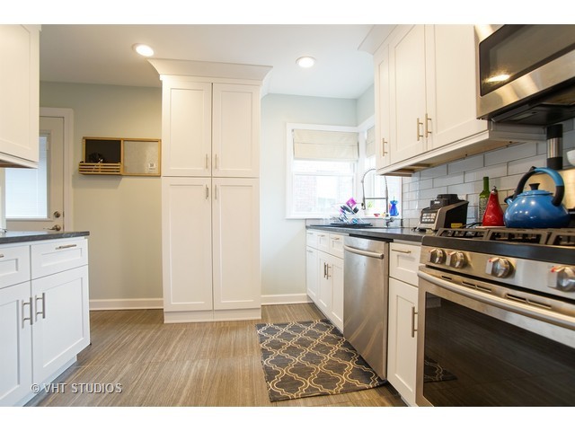 1813 Marguerite Street Park Ridge, IL 60068 - Photo 5 of 15 a kitchen with cabinets and wooden floor