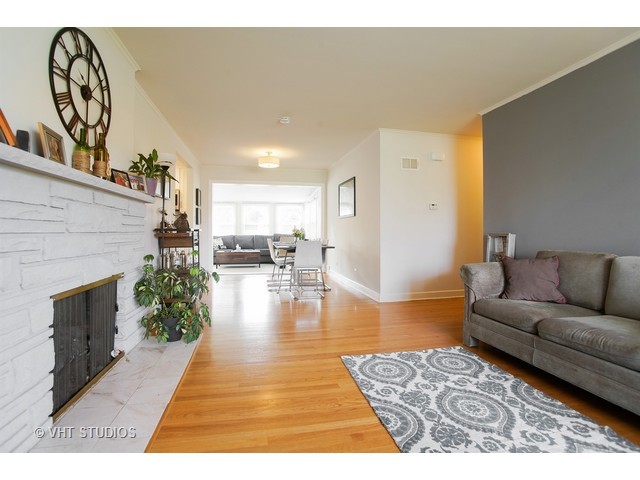 1813 Marguerite Street Park Ridge, IL 60068 - Photo 8 of 15 a living room with furniture and a fireplace