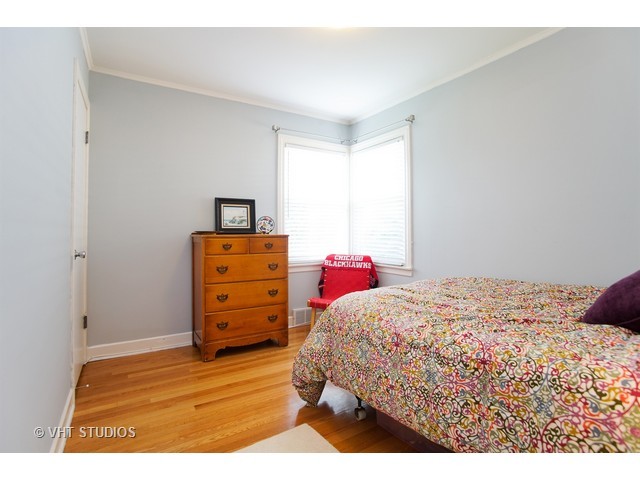 1813 Marguerite Street Park Ridge, IL 60068 - Photo 10 of 15 a bedroom with a bed and wooden floor