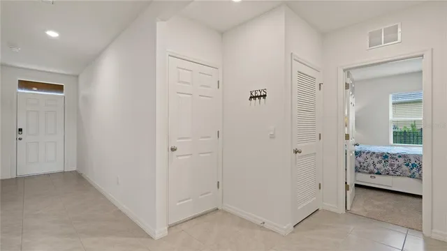a view of room with closet and mirror