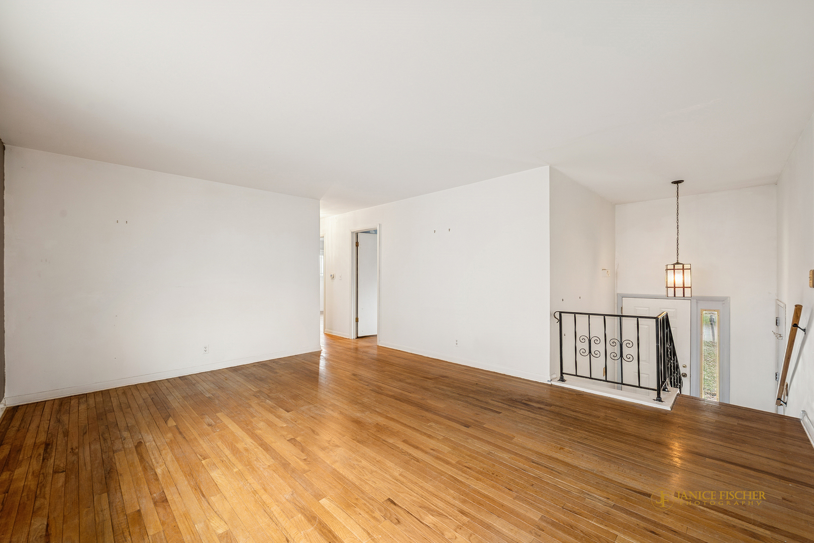 418 Glen Garry Road Cary, IL 60013 - Photo 6 of 15 a view of an empty room with wooden floor