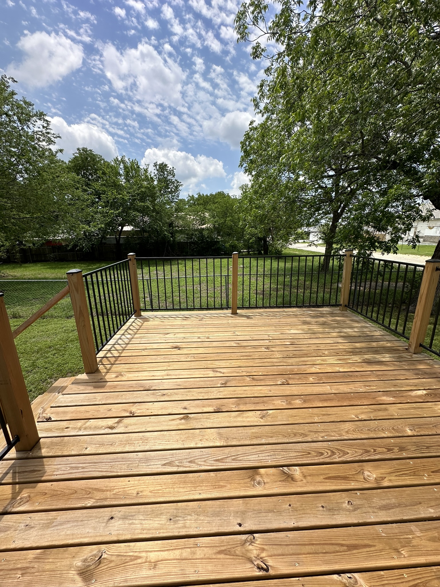719 West 3rd Street Taylor, TX 76574 - Photo 19 of 31 Wooden terrace featuring a yard