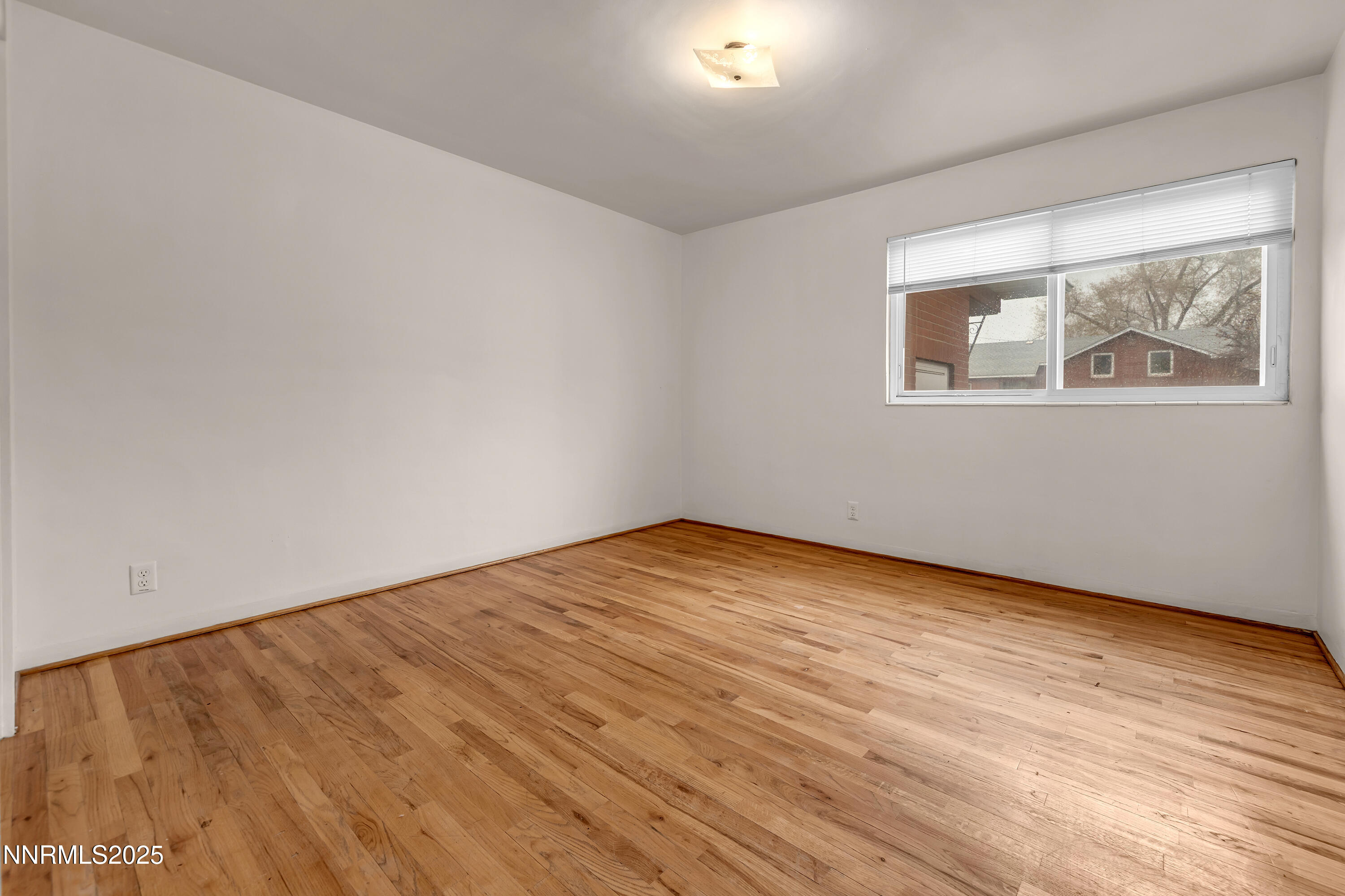 234 18th Street Sparks, NV 89431 - Photo 35 of 51 a view of empty room with wooden floor and fan