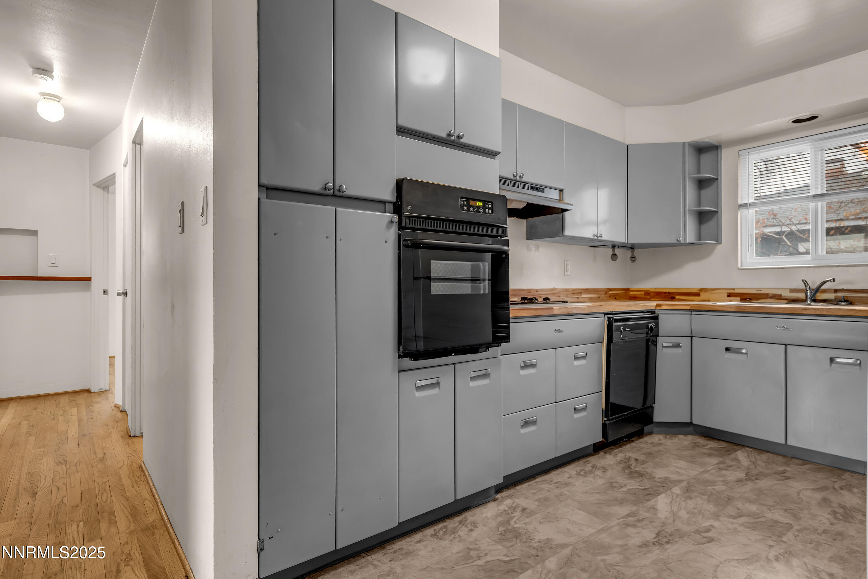 234 18th Street Sparks, NV 89431 - Photo 40 of 51 a kitchen with white cabinets a sink and appliances