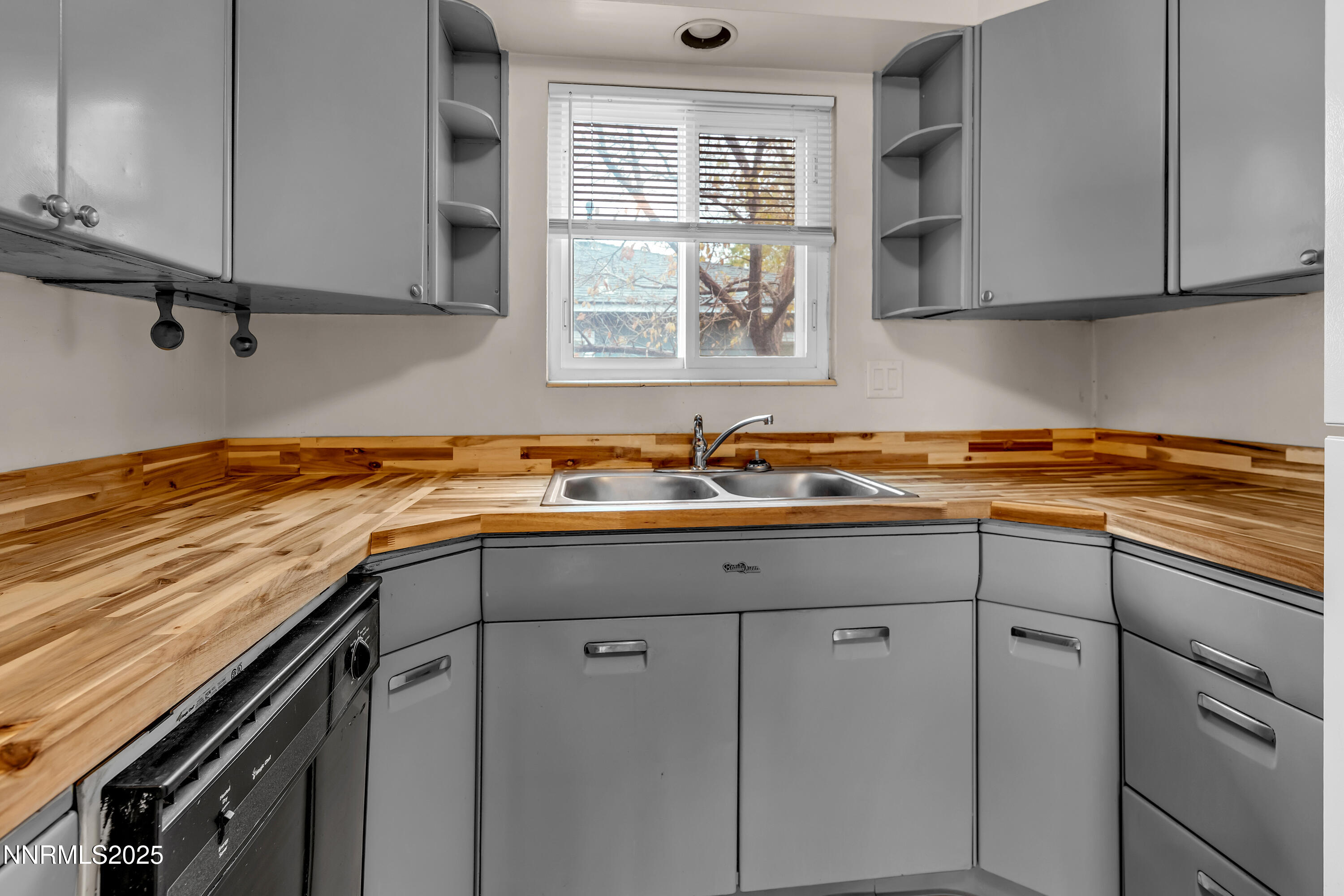 234 18th Street Sparks, NV 89431 - Photo 42 of 51 a view of a kitchen with stainless steel appliances granite countertop a sink and cabinets