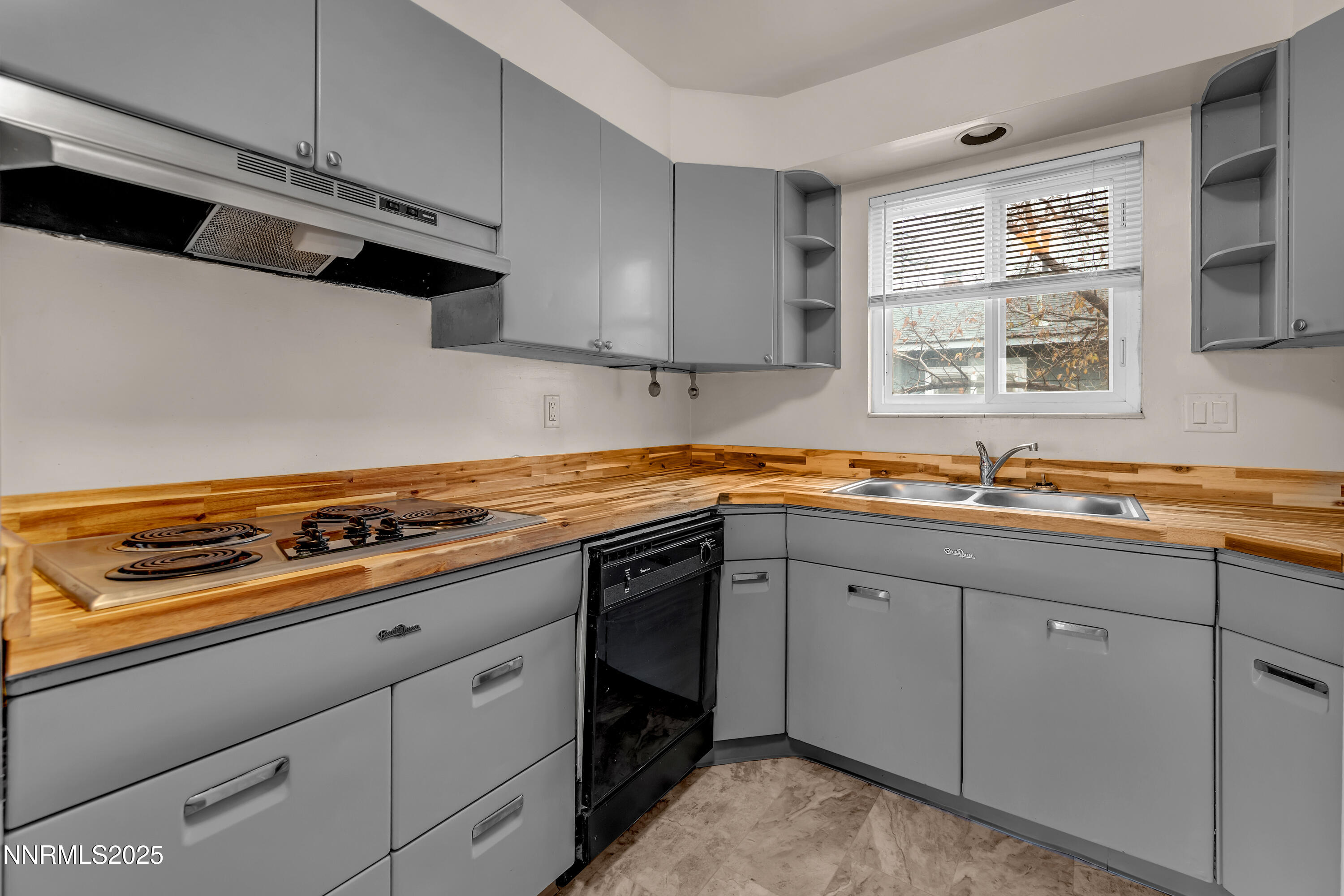 234 18th Street Sparks, NV 89431 - Photo 43 of 51 a kitchen with stainless steel appliances a sink stove and cabinets