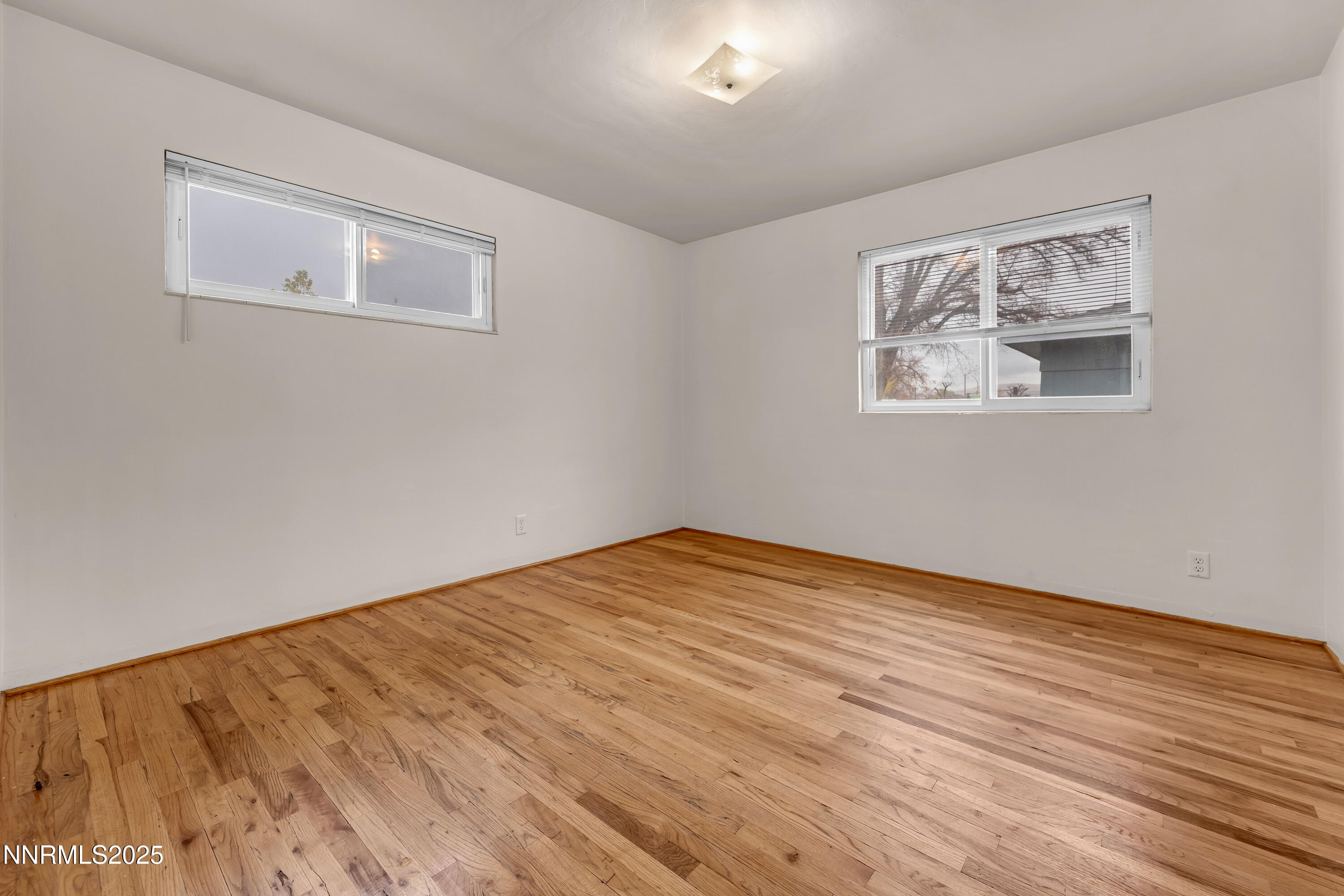 234 18th Street Sparks, NV 89431 - Photo 50 of 51 a view of an empty room with wooden floor and a window