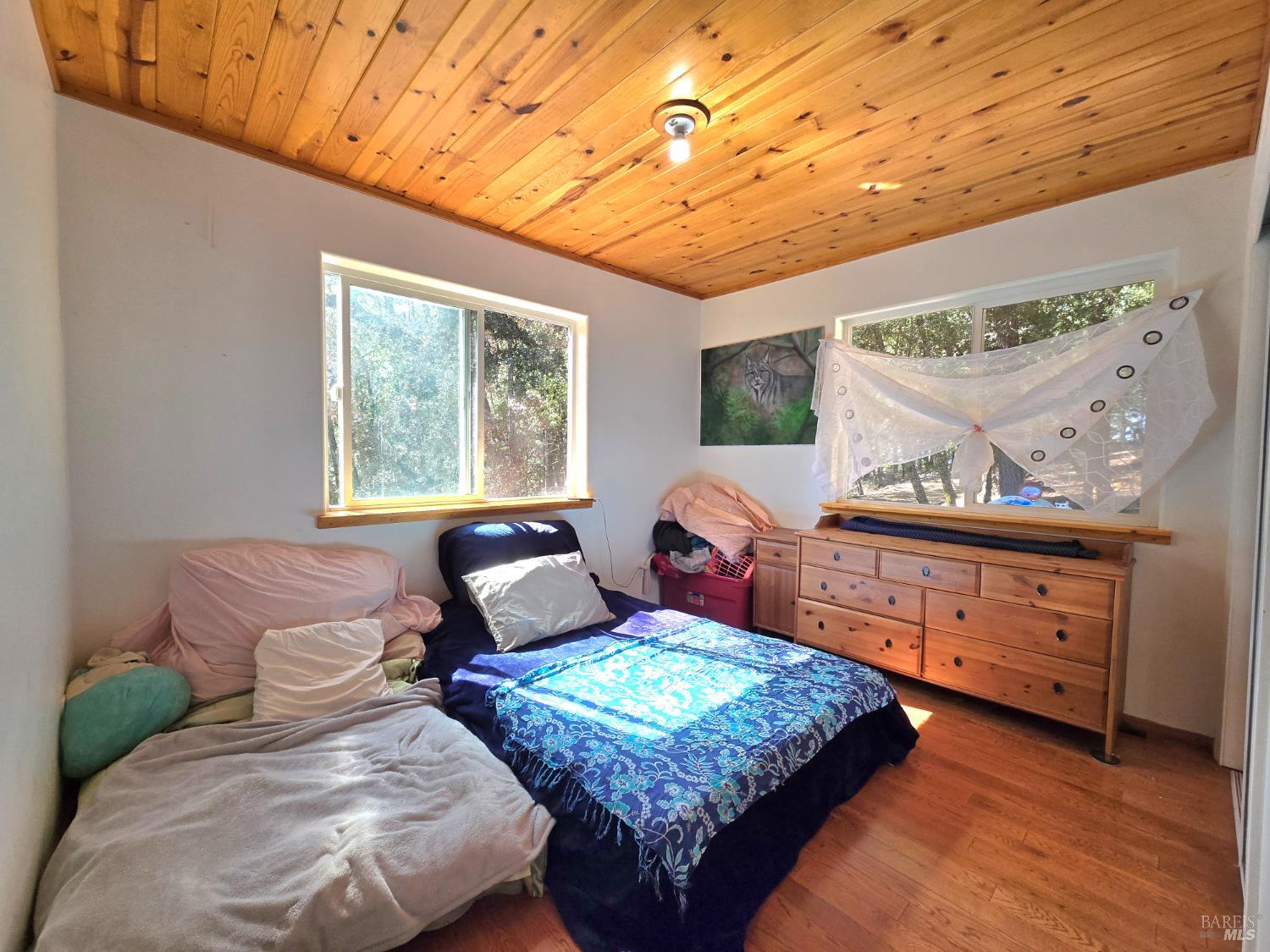 36193 Covelo Road Willits, CA 95490 - Photo 12 of 30 a bedroom with a bed window and couch