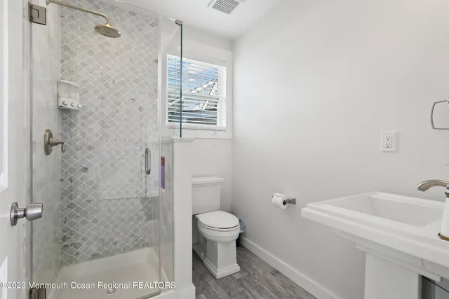 a bathroom with a toilet and a sink