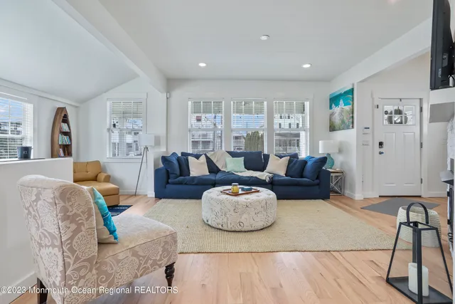 a living room with furniture and a table