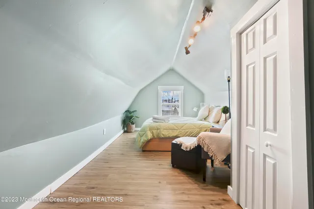 a bed room with a bed and a window