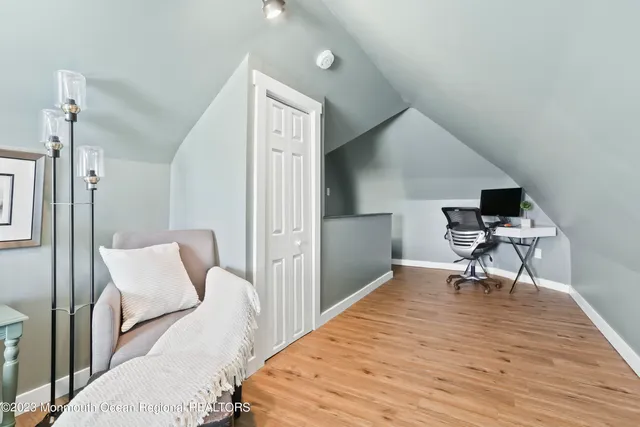 a bedroom with furniture and a chair