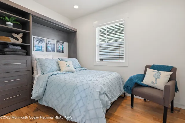 a bedroom with a bed and dresser