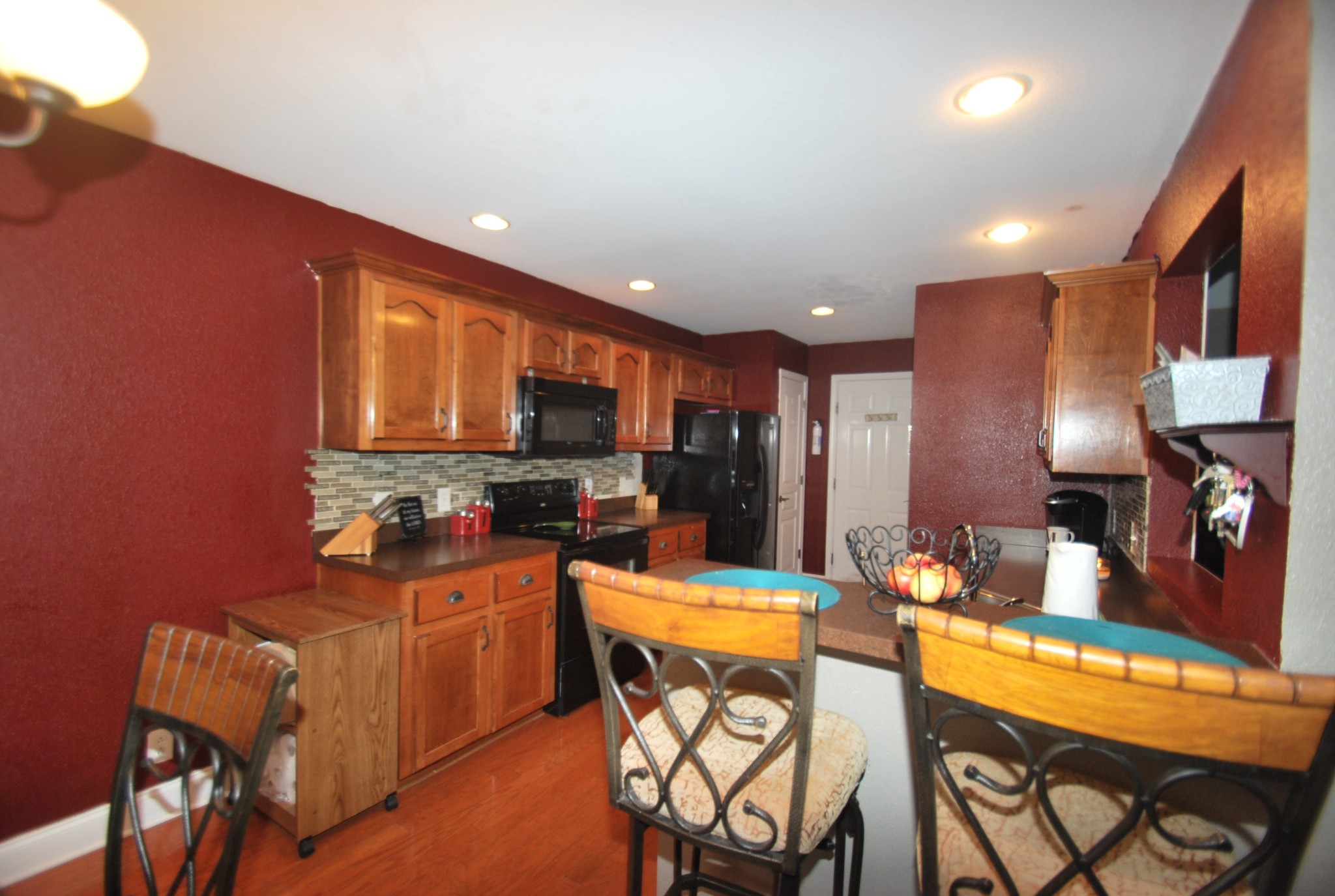 822 Red Hollow Drive Springfield, TN 37172 - Photo 14 of 19 a kitchen with stainless steel appliances kitchen island granite countertop a sink cabinets and wooden floor