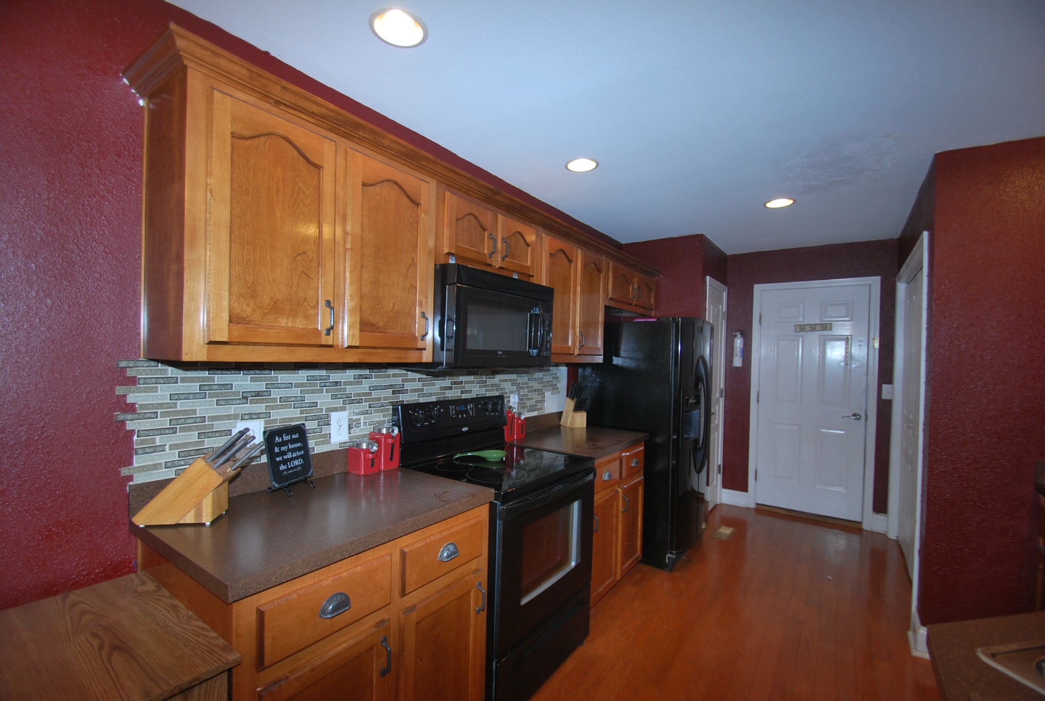 822 Red Hollow Drive Springfield, TN 37172 - Photo 16 of 19 a kitchen with stainless steel appliances granite countertop a refrigerator a sink dishwasher a stove and a microwave oven on granite countertops