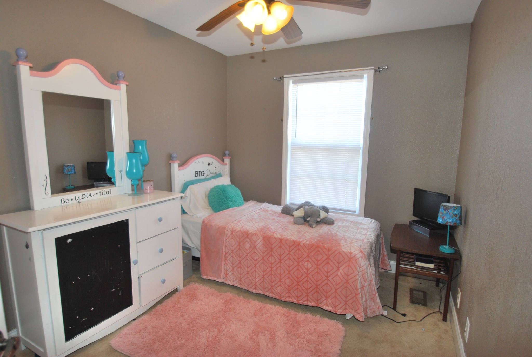 822 Red Hollow Drive Springfield, TN 37172 - Photo 8 of 19 a bedroom with a bed and a chandelier