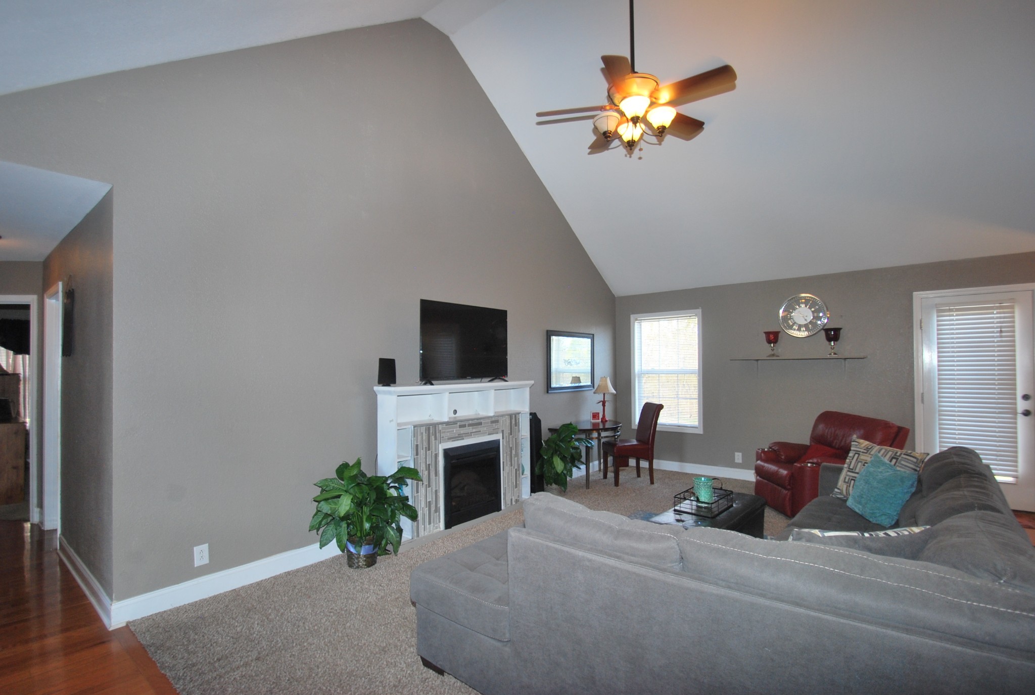 822 Red Hollow Drive Springfield, TN 37172 - Photo 9 of 19 a living room with furniture a fireplace and a flat screen tv