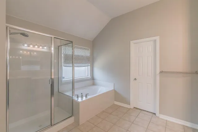 a spacious bathroom with a double vanity sink mirror and double