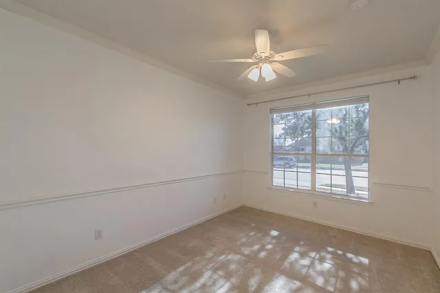 a view of a big room with closet and fan