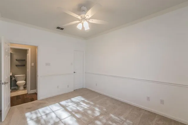 a view of a dining room with furniture wooden floor and a chandelier