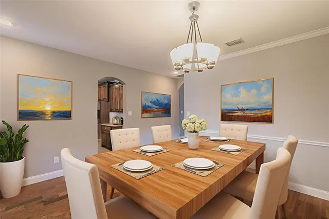 a kitchen with stainless steel appliances granite countertop a stove sink and cabinets