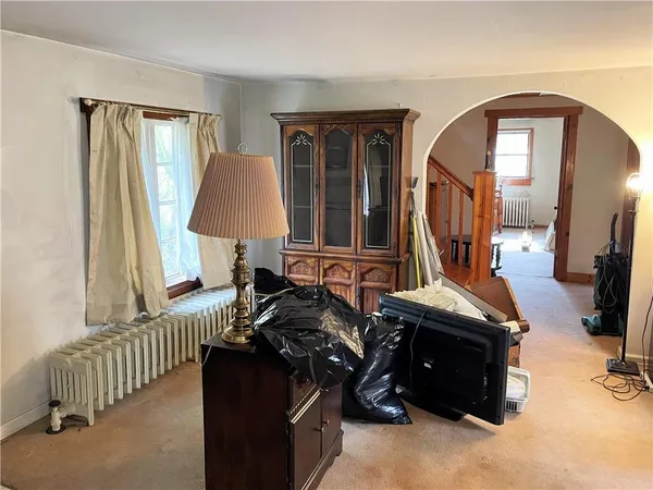 a room with furniture and a flat screen tv