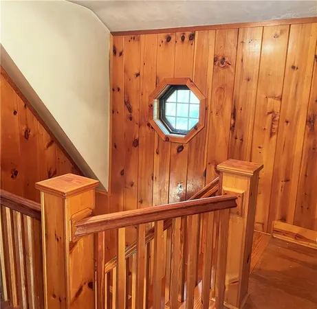 a view of a porch with wooden floor