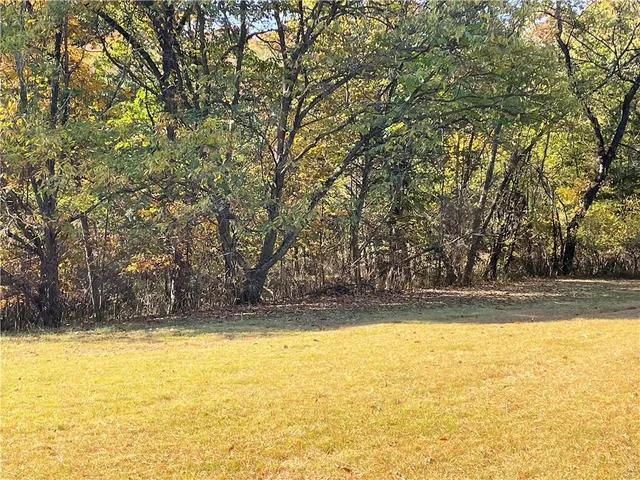 a view of a swimming pool with an outdoor space and seating area