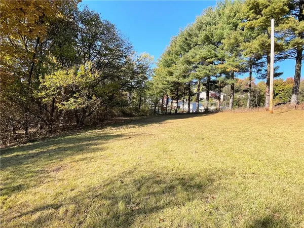 a view of an ocean with a house