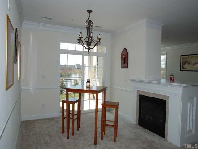 10511 Rosegate Court, Unit 6 Raleigh, NC 27617 - Photo 4 of 11 a view of a livingroom with furniture window and outside view