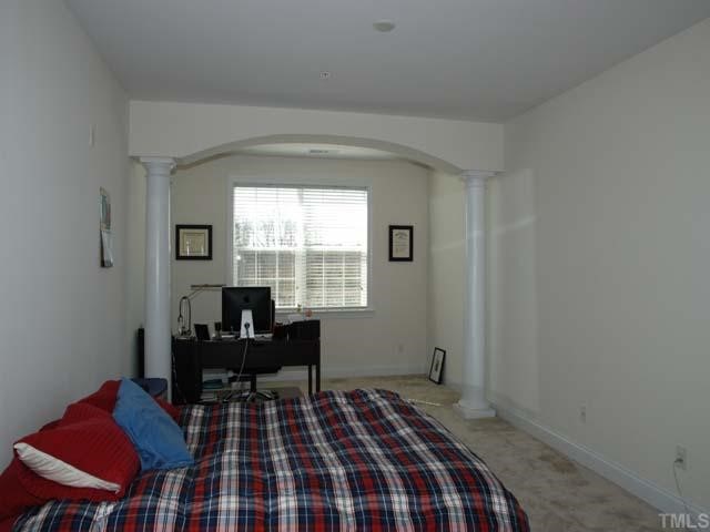 10511 Rosegate Court, Unit 6 Raleigh, NC 27617 - Photo 5 of 11 a bedroom with a bed and a window