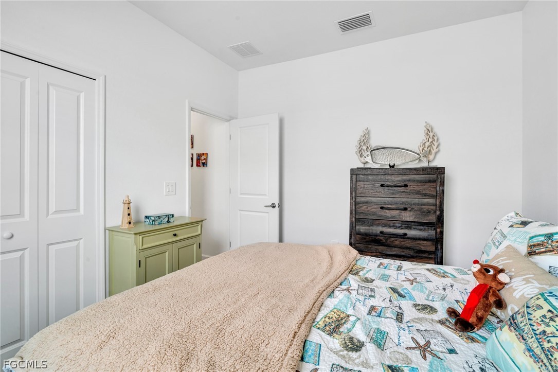 17388 Walnut Run Drive Alva, FL 33920 - Photo 16 of 24 a bedroom with a bed and closet