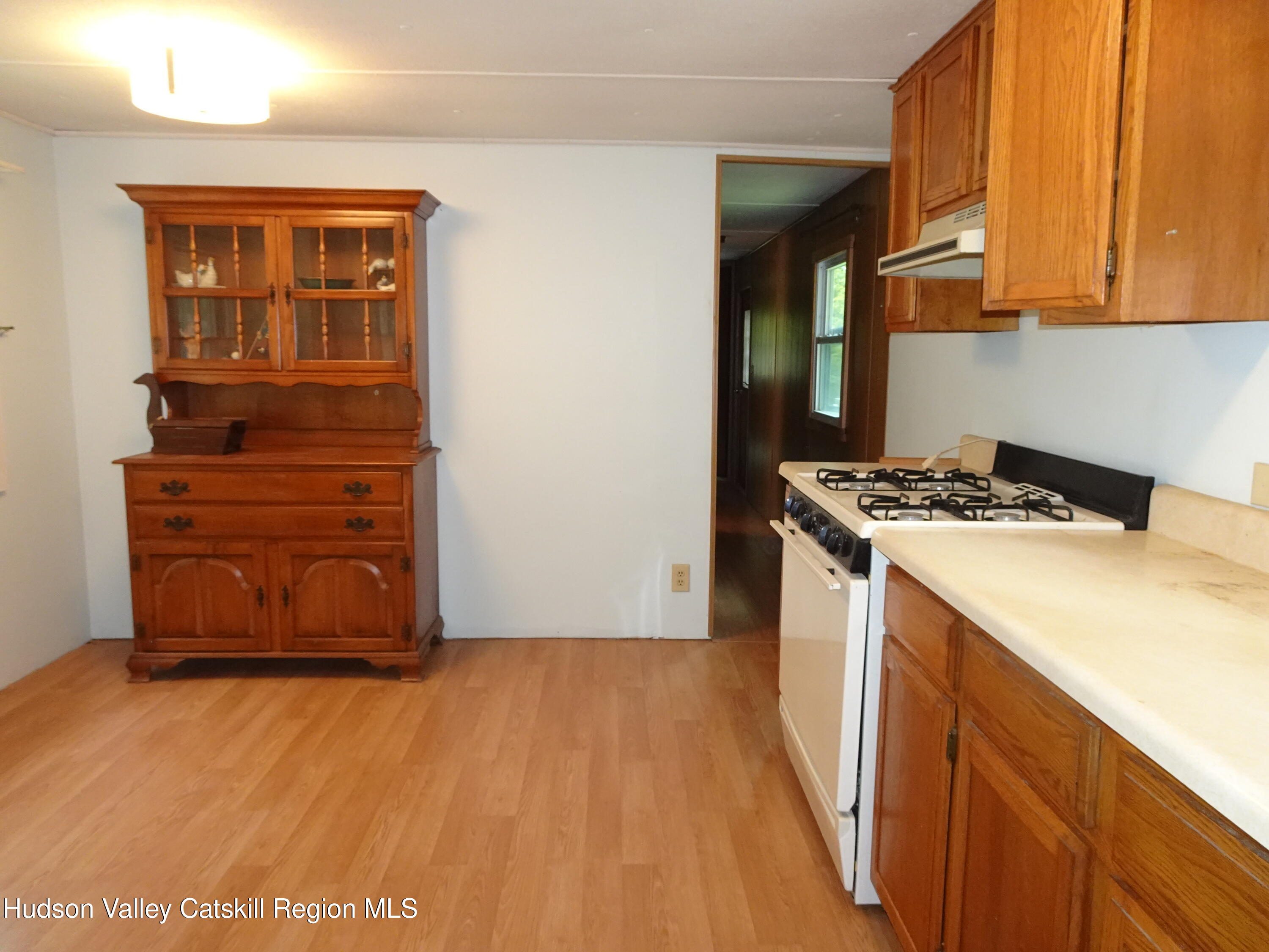 158 Middle Road Austerlitz, NY 12017 - Photo 11 of 20 a kitchen with a cabinets and wooden floor