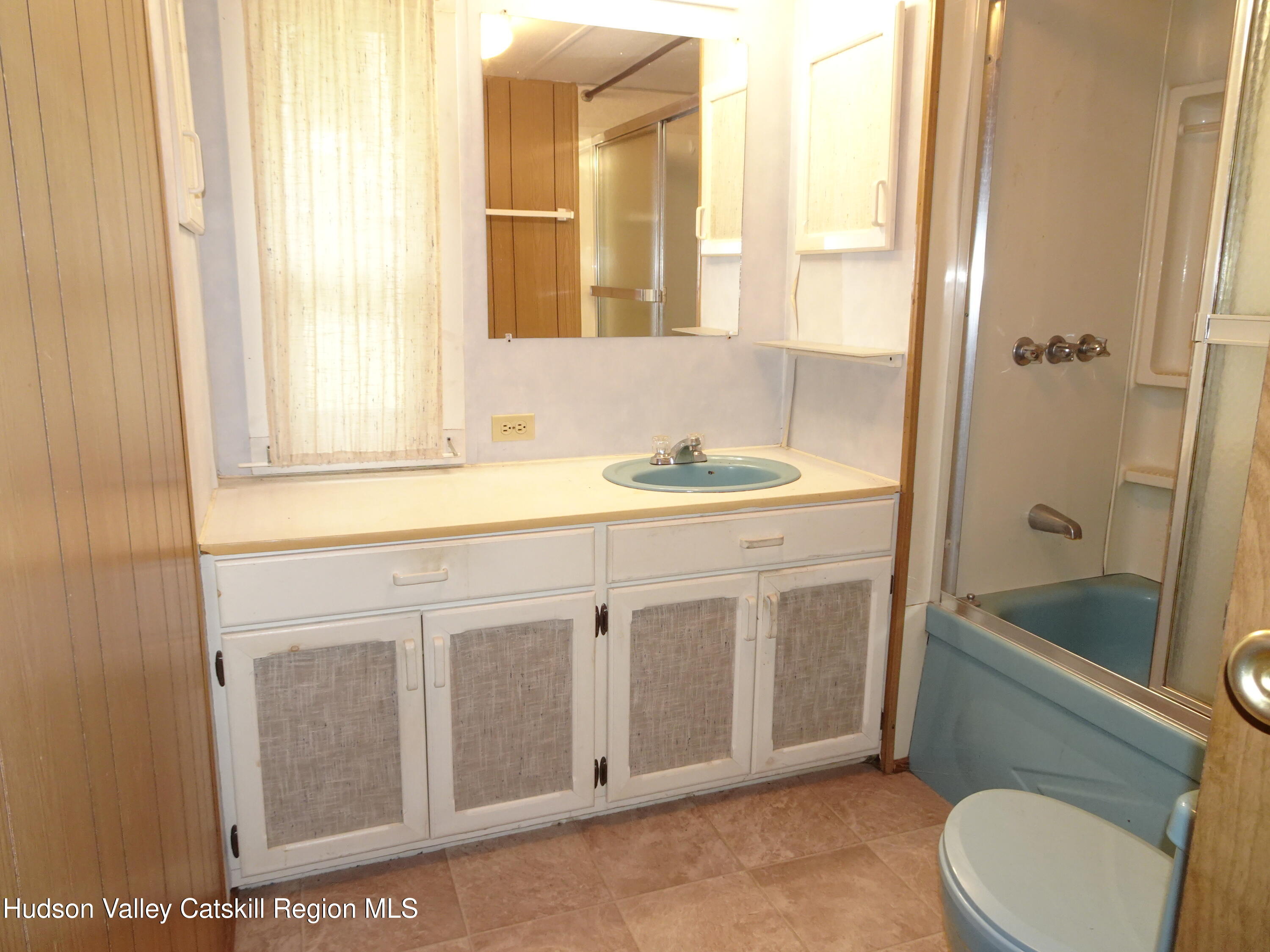 158 Middle Road Austerlitz, NY 12017 - Photo 13 of 20 a bathroom with a sink a toilet and shower