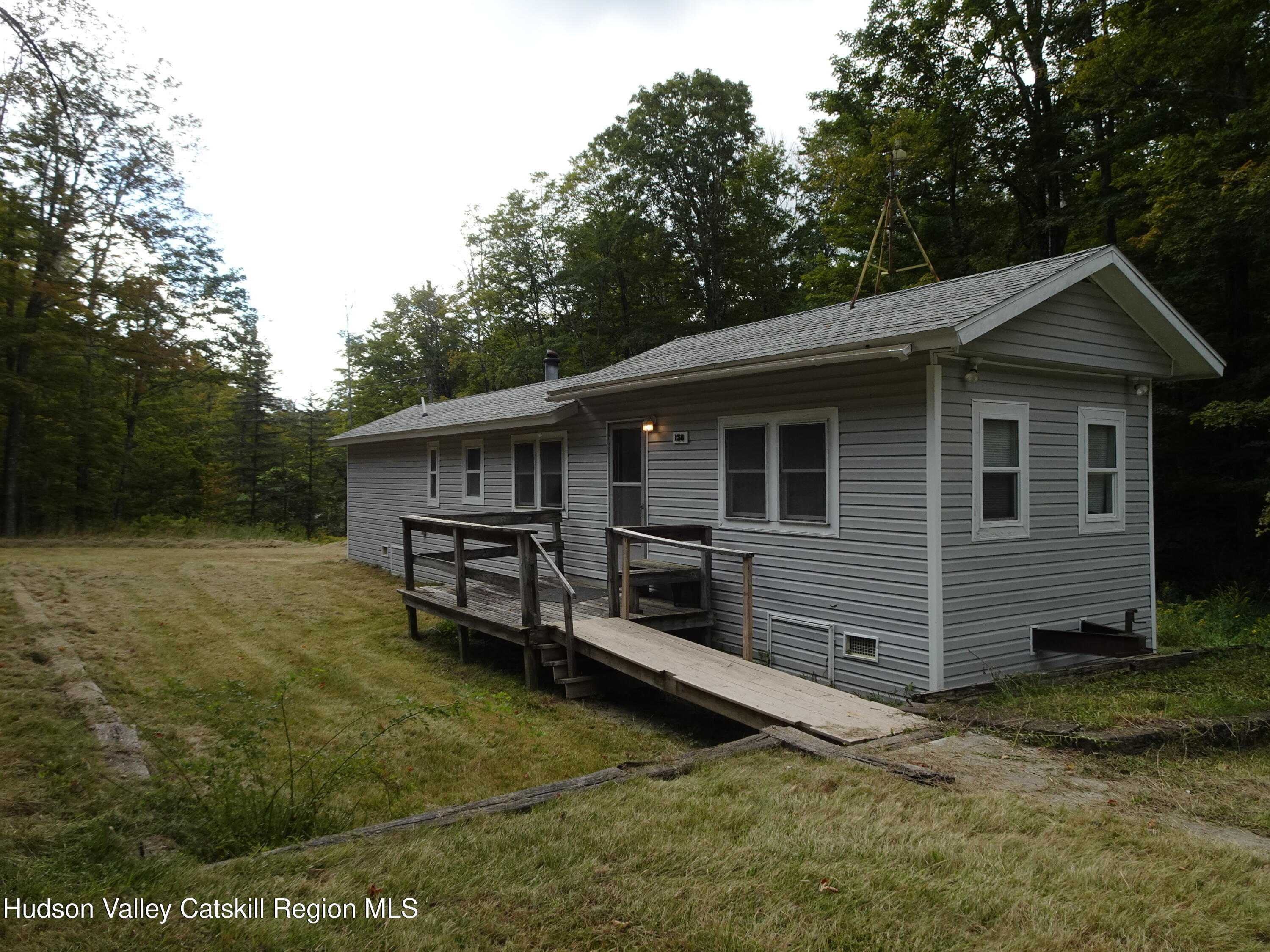 158 Middle Road Austerlitz, NY 12017 - Photo 5 of 20 a view of a house with a yard and wooden fence
