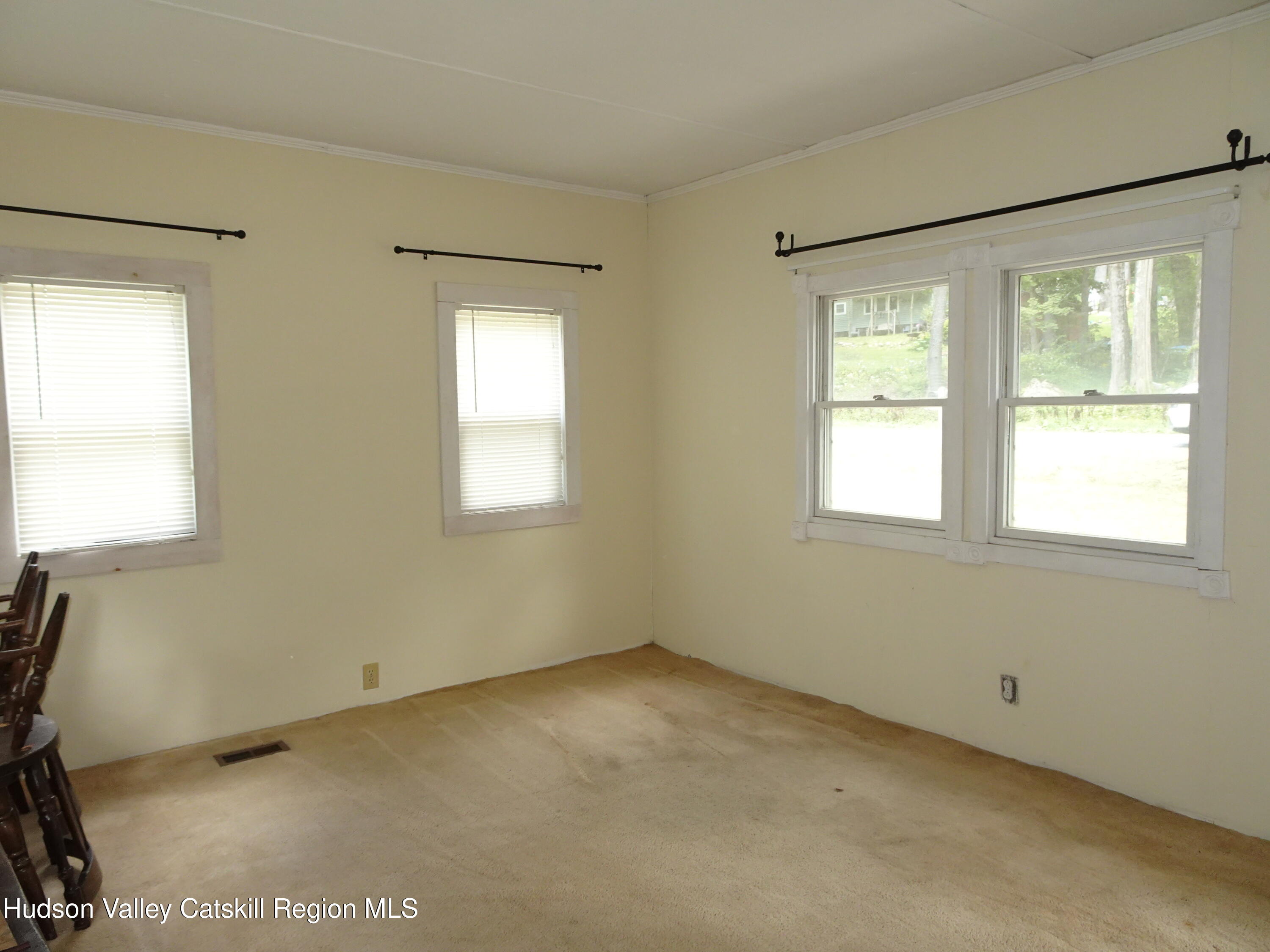 158 Middle Road Austerlitz, NY 12017 - Photo 6 of 20 a view of an empty room with a window