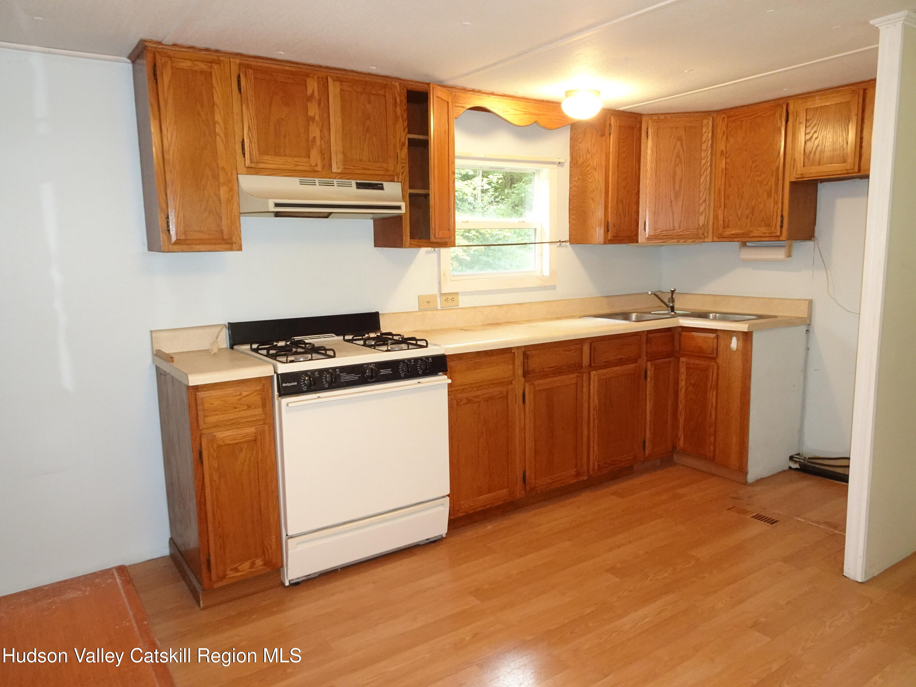 158 Middle Road Austerlitz, NY 12017 - Photo 8 of 20 a kitchen with stainless steel appliances granite countertop a stove a sink and a refrigerator