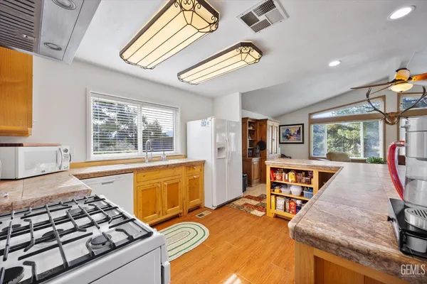 a bedroom with furniture and a large window