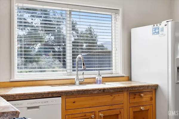 a view of a sink and a window