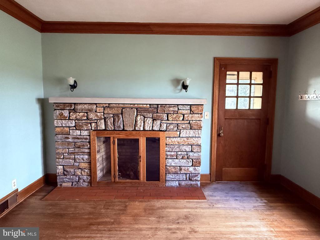 6245 Middleburg Road Keymar, MD 21757 - Photo 47 of 77 a view of an empty room with a fireplace and a window