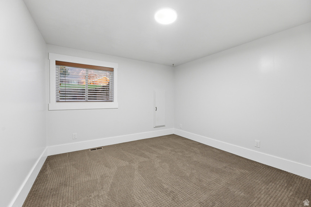2342 Charros Road Sandy, UT 84092 - Photo 57 of 94 Carpeted room with a recessed window featuring wood-tone blinds